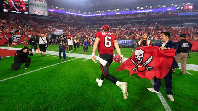 Baker Mayfield of the Tampa Bay Buccaneers runs off the field after defeating the Philadelphia Eagles in the NFC Wild Card Playoffs. Tampa Bay faces the Detroit Lions in the Divisional Round on Saturday.