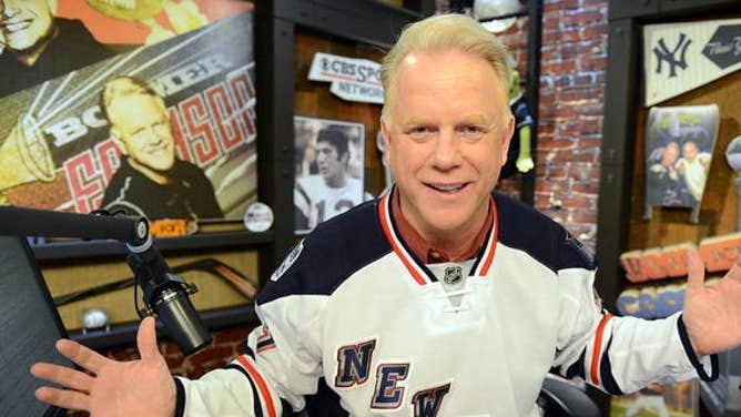Boomer Esiason wearing a New York Rangers jersey on his radio show at the WFAN studio in New York.