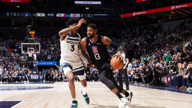 Los Angeles Clippers SF Paul George drives to the basket against the Minnesota Timberwolves during the 2022 Play-In Tournament at Target Center in Minneapolis, Minnesota.