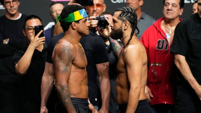 Gilbert Burns and Jorge Masvidal stare each other down during the UFC 287 weigh-in at Kaseya Center in Miami.