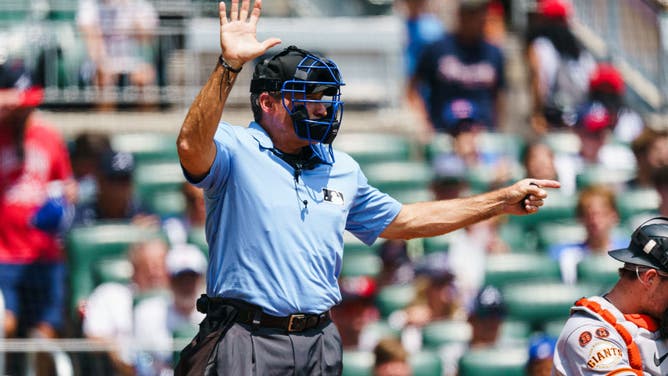 MLB umpire Angel Hernandez calls time in the first inning during the game between the Atlanta Braves and San Francisco Giants at Truist Park on August 20, 2023 in Atlanta, Georgia.