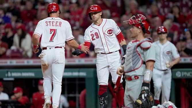 Reds 3B Spencer Steer and LF TJ Friedl celebrate after Steer scores a run in the 7th inning vs. the Phillies at Great American Ball Park in Cincinnati, Ohio.