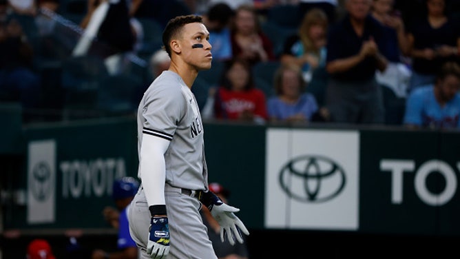 Aaron Judge #99 of the New York Yankees reacts after hitting into a double play against the Texas Rangers during the third inning at Globe Life Field on October 3, 2022 in Arlington, Texas.