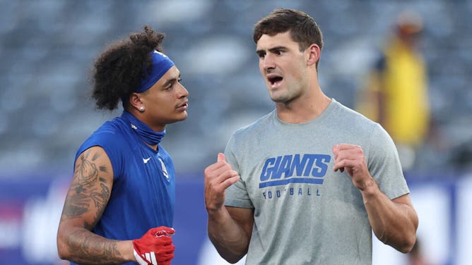 Jalin Hyatt and Daniel Jones of the New York Giants talk during warmups prior to a game against the Dallas Cowboys.