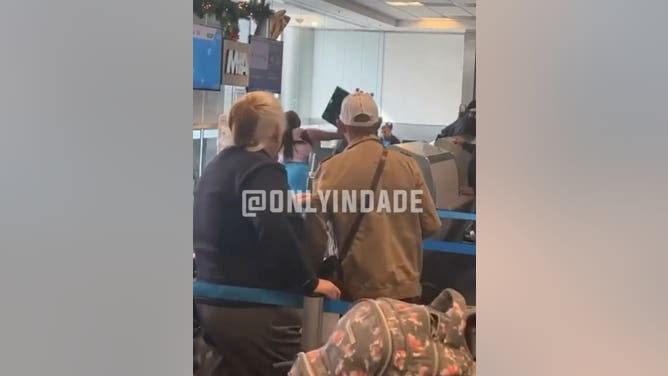 Mother of two goes crazy at Miami airport.