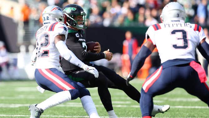 Jets quarterback Zach Wilson struggles against the Patriots.