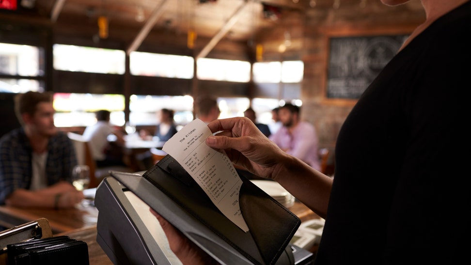 Preparing the bill at a restaurant to be taken to a table