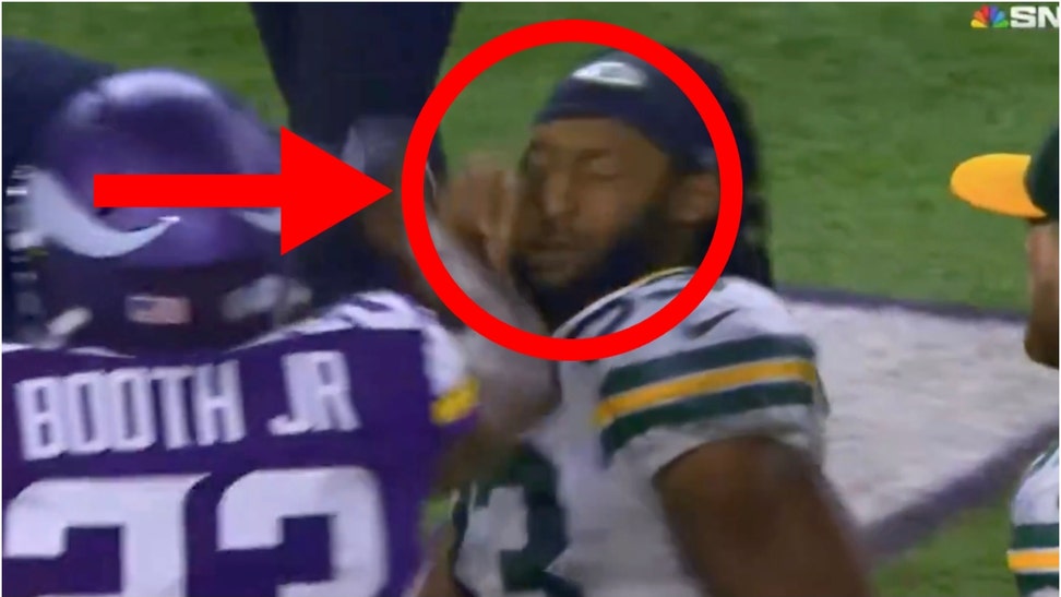 Aaron Jones punched in the face by a teammate. (Credit: Screenshot/X Video https://twitter.com/barstoolsports/status/1741676523873022276)