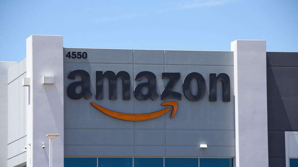 An Amazon logo is displayed on a fulfillment center