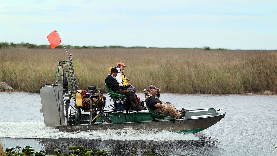 Florida parents made sure their kid's baseball game was played, using air-boats to dry the field