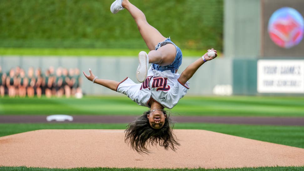 Suni Lee flipping before first pitch