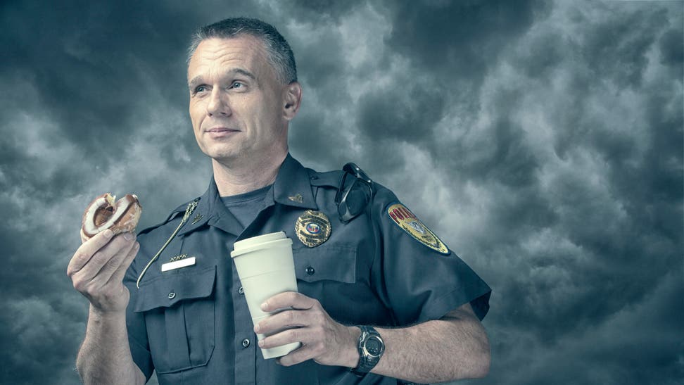 5f82b888-Policeman excited about his donut and coffee break