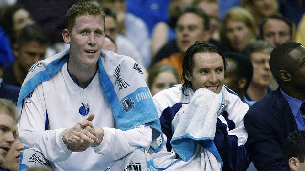 Shawn Bradley and Steve Nash watch the game
