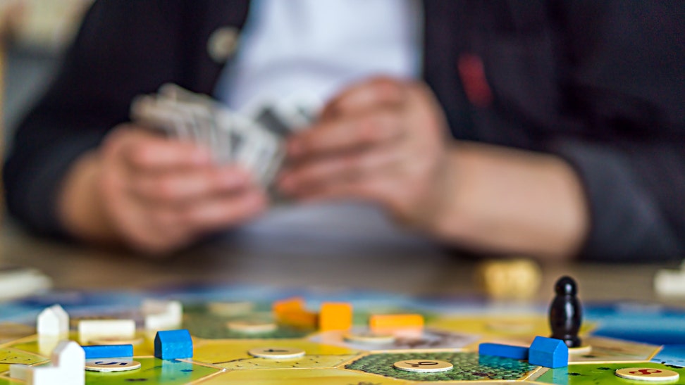 Guy playing a board game