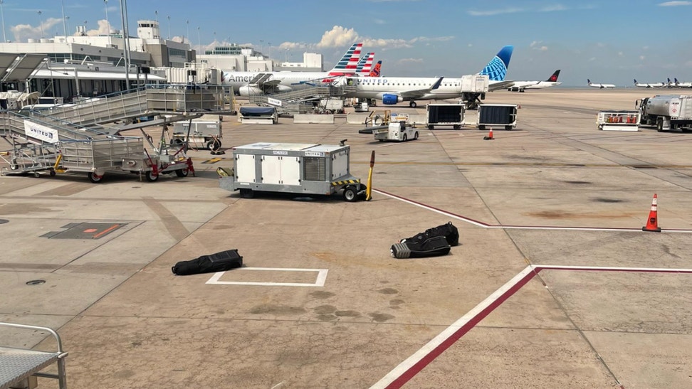 Collin Morikawa Sees His Golf Clubs Fall Off Luggage Cart At Airport