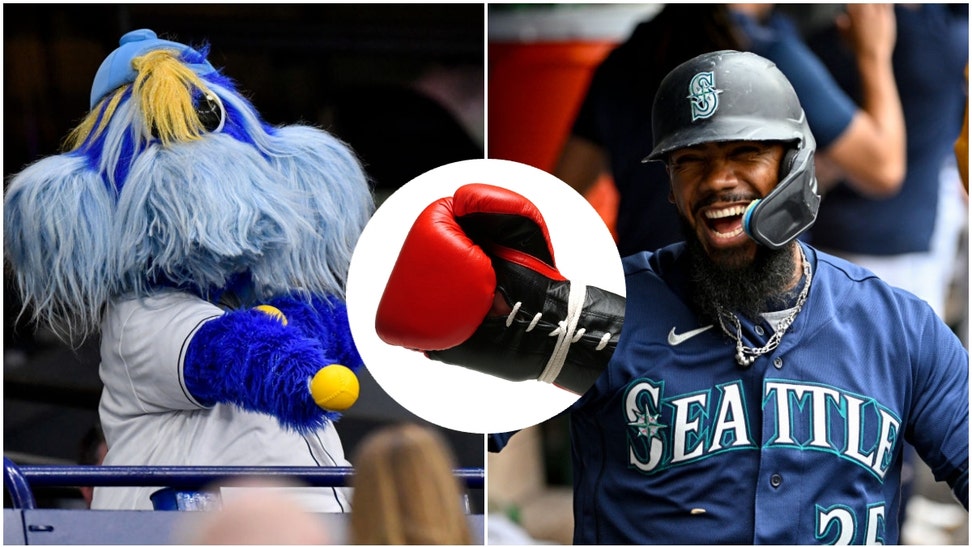 Tampa Bay rays mascot Raymond and Seattle Mariners outfielder eoscar Hernández
