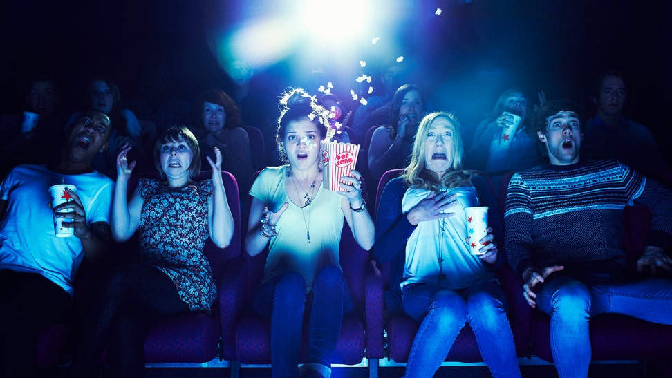 27971ac7-Audience enjoying movie at the cinema