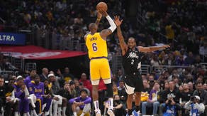 Los Angeles Lakers' LeBron James shoots a three over Clippers All-Star Kawhi Leonard at Crypto.com Arena.
