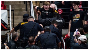 Things went south during the Texas-Texas Tech game last night and one fan was dragged out of the arena. 