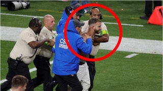 A streaker ran on the field during the Super Bowl between the Chiefs and 49ers. Watch a video of security taking him down. (Credit: Getty Images)