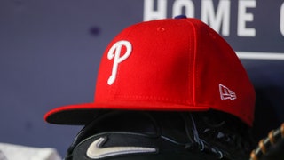 Philadelphia Phillies hat on top of a glove