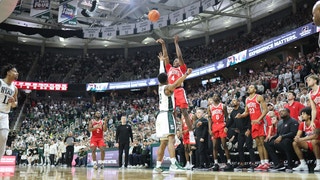 Dale Bonner of the Ohio State Buckeyes shoots the game-winning shot over Tyson Walker of the Michigan State Spartans.