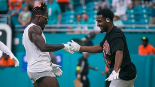 Miami Dolphins wide receiver Tyreek Hill (10) hi-fives Miami Dolphins wide receiver Jaylen Waddle (17) on the field prior to the the start of the game between host Miami Dolphins and the Houston Texans at Hard Rock Stadium.