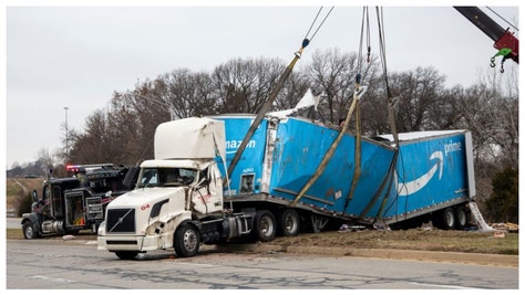 Amazon truck split in half by train in crazy video that's going viral. 