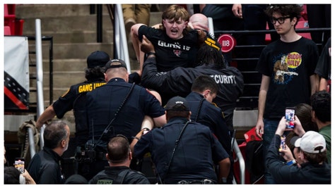 Things went south during the Texas-Texas Tech game last night and one fan was dragged out of the arena. 