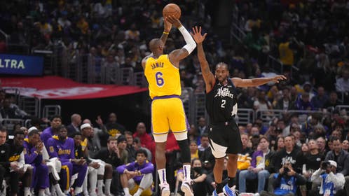 Los Angeles Lakers' LeBron James shoots a three over Clippers All-Star Kawhi Leonard at Crypto.com Arena.