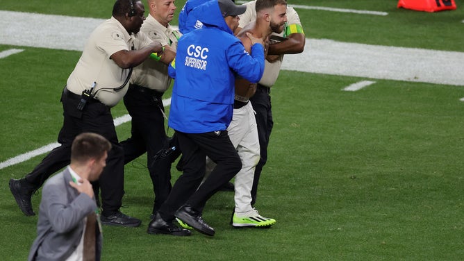A streaker ran on the field during the Super Bowl between the Chiefs and 49ers. Watch a video of security taking him down.(Photo by Ethan Miller/Getty Images)