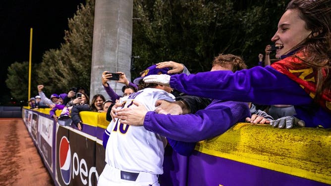 East Carolina's Parker Byrd celebrates with fans following his debut that saw him become the first ever Division-1 player to compete with a prosthetic leg