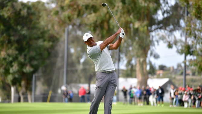 Tiger Woods hits an approach shot on the 11th hole fairway at The 2023 Genesis Invitational. (Gary A. Vasquez-USA TODAY Sports)