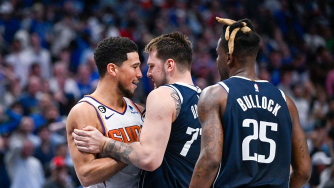 Phoenix Suns All-Star Devin Booker exchanges words with Dallas Mavericks All-Star Luka Doncic at the American Airlines Center in Texas. 