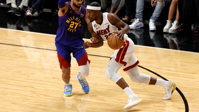 Miami Heat SF Jimmy Butler drives past Denver Nuggets PG Jamal Murray in Game 3 of the 2023 NBA Finals at Kaseya Center. (Sam Navarro-USA TODAY Sports)