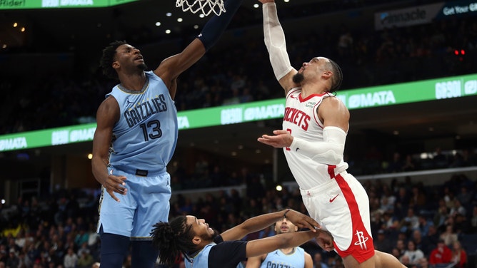 Houston Rockets SF Dillon Brooks takes a layup with Memphis Grizzlies big Jaren Jackson Jr. contesting at the rim at FedExForum in Tennessee. (Petre Thomas-USA TODAY Sports)