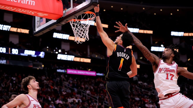 Phoenix Suns All-Star Devin Booker makes a layup on the Houston Rockets at Toyota Center in Texas. 