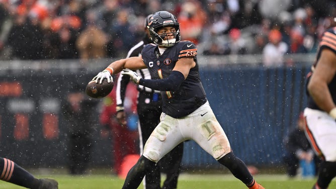 Bears QB Justin Fields drops back to pass against the Atlanta Falcons at Soldier Field in Chicago.