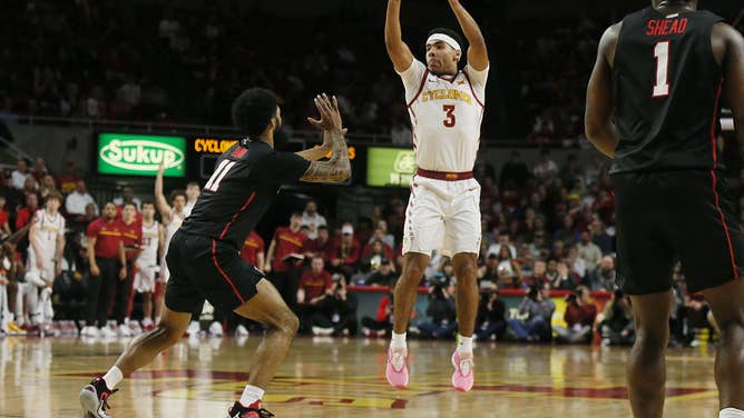 Iowa State Cyclones guard Tamin Lipsey shoots 3-pointer over Houston Cougars guard Damian Dunn at Hilton Coliseum in Ames, Iowa.