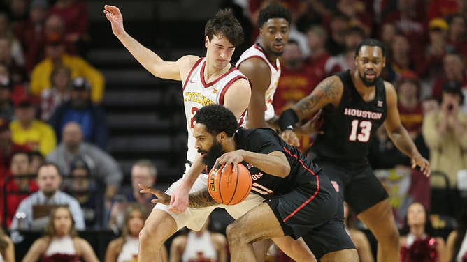 Iowa State Cyclones F Milan Momcilovic defends Houston Cougars G Damian Dunn at Hilton Coliseum.