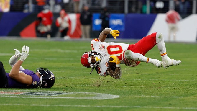 Baltimore Ravens S Kyle Hamilton lights up Kansas City Chiefs RB Isiah Pacheco after a catch during the 2024 AFC Championship game at M&T Bank Stadium in Maryland.