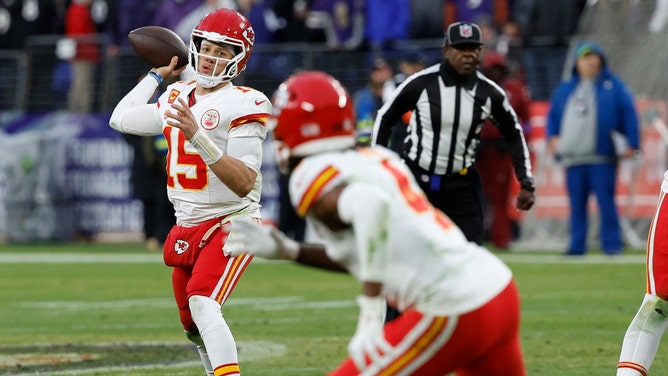 Kansas City Chiefs quarterback Patrick Mahomes (15) passes the ball to Chiefs wide receiver Rashee Rice (4) against the Baltimore Ravens in the AFC Championship football game at M&T Bank Stadium.