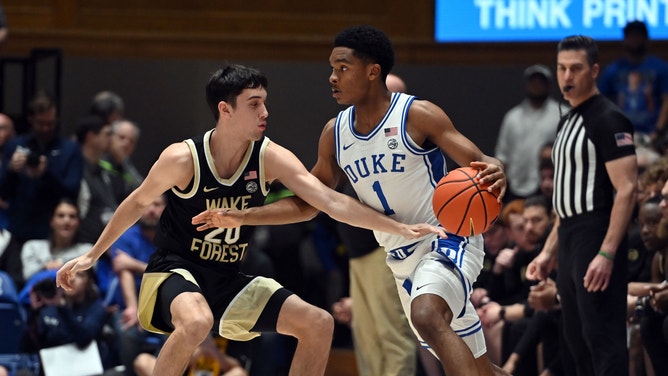 Duke Blue Devils guard Caleb Foster controls with Wake Forest Deamon Deacons guard Parker Friedrichsen playing defense at Cameron Indoor Stadium in North Carolina. 
