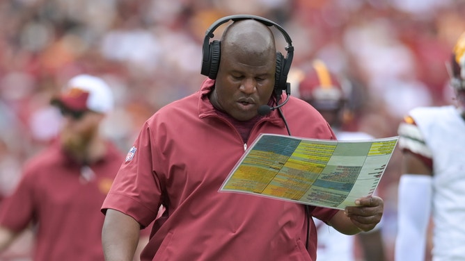 Washington Commanders assistant head coach/offensive coordinator Eric Bieniemy walks down the sidelines during the first half against the Arizona Cardinals at FedExField