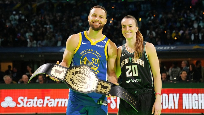 Golden State Warriors guard Stephen Curry (30) and New York Liberty guard Sabrina Ionescu (20) after the Stephen vs Sabrina three-point challenge during NBA All Star Saturday Night at Lucas Oil Stadium.