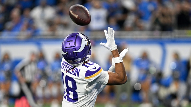 Minnesota Vikings wide receiver Justin Jefferson (18) catches a pass for a touchdown against the Detroit Lions in the third quarter at Ford Field.