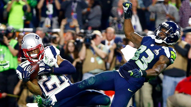 New England Patriots strong safety Malcolm Butler (21) intercepts a pass intended for Seattle Seahawks wide receiver Ricardo Lockette (83) in the fourth quarter in Super Bowl XLIX at University of Phoenix Stadium.
