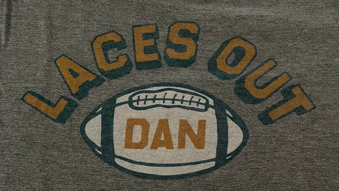 Dan's shirt that references the famous Ace Ventura quote: "Laces Out, Dan"