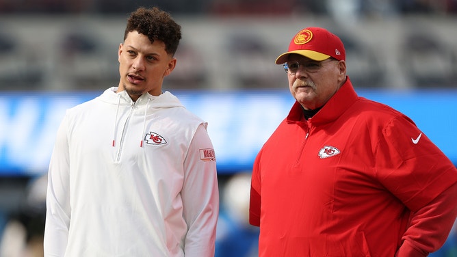 Patrick Mahomes #15 of the Kansas City Chiefs and head coach Andy Reid speak before a game against the Los Angeles Chargers at SoFi Stadium