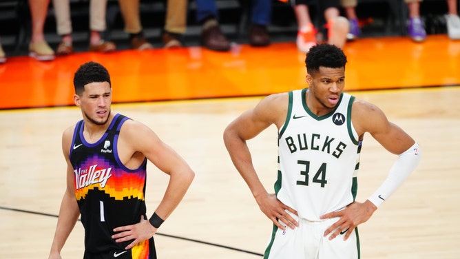 Milwaukee Bucks pF Giannis Antetokounmpo and Phoenix Suns SG Devin Booker during Game 5 of the 2021 NBA Finals in Arizona.